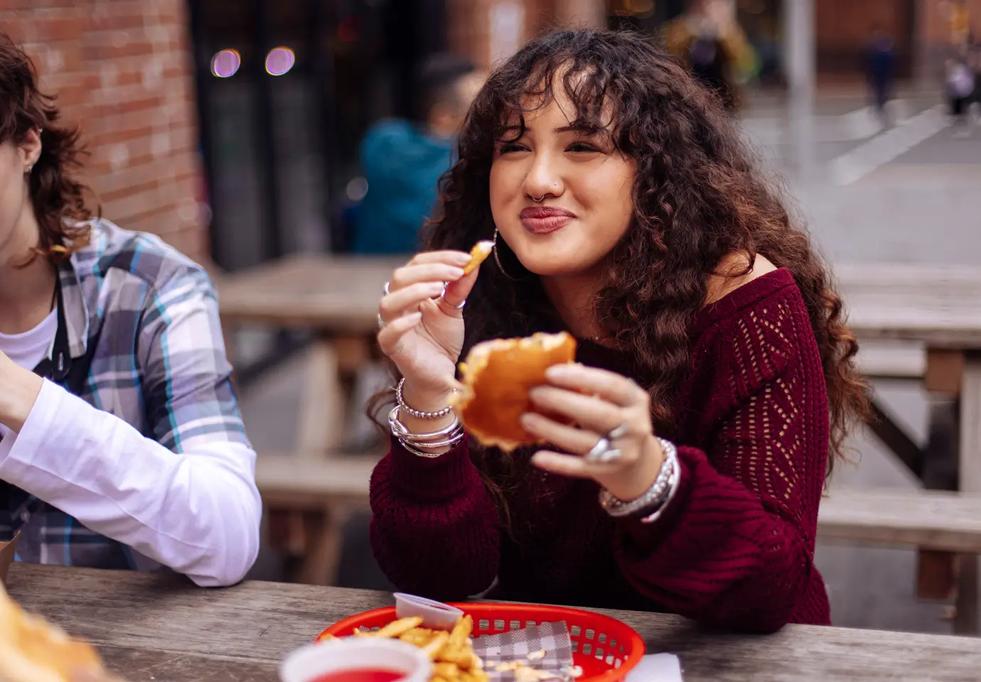 young woman eating a hamburger